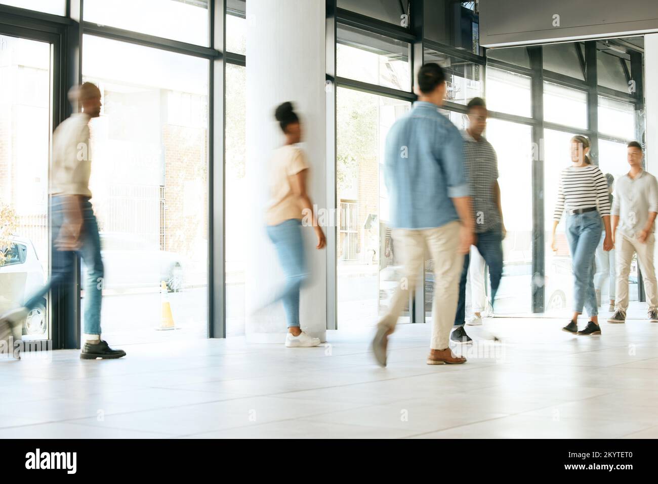 Business people, busy office and walking fast at work, diversity and productive with blur, moving and company growth. Staff, corridor and walk with Stock Photo