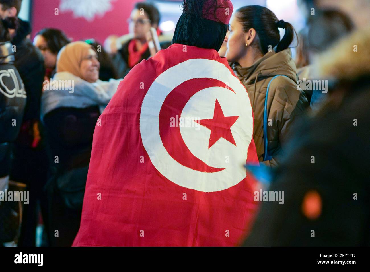 Paris, France, 01/12/2022. Moroccan and Tunisian supporters celebrate Morocco's qualification for the FIFA World Cup in Qatar, on the Champs Elysees, in Paris. Pierre Galan/Alamy Live News Stock Photo