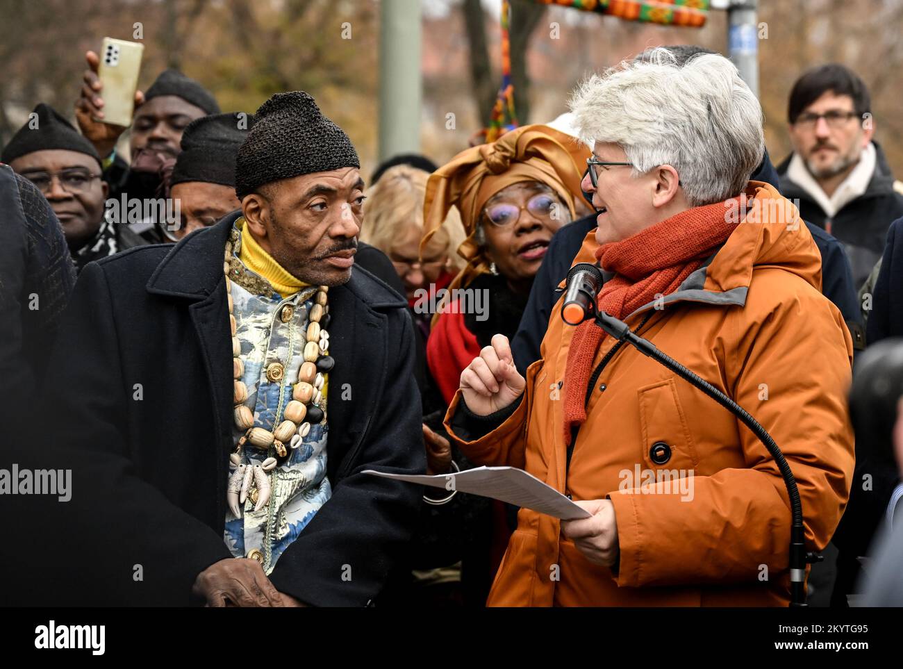 Berlin, Germany. 02nd Dec, 2022. District Mayor of the Mitte district, Stefanie Remlinger (Bündnis 90/Die Grünen) and the King Jean-Yves Eboumbou Douala Bell at the street renaming in the African Quarter. The 'Nachtigalplatz' was renamed 'Manga Bell Square'. This honors the resistance fighters Rudolf and Emily Duala Manga Bell during the German colonial period in Cameroon. Credit: Britta Pedersen/dpa/Alamy Live News Stock Photo