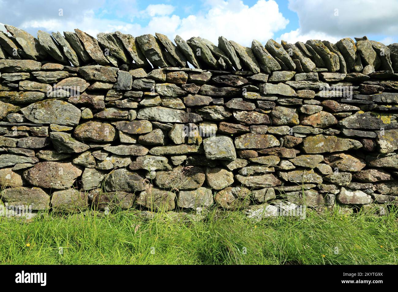 Example of volcanic dry stone wall from Borrowdale in the central Cumbrian fells of Cumbria, England - made from igneous volcanic rock Stock Photo