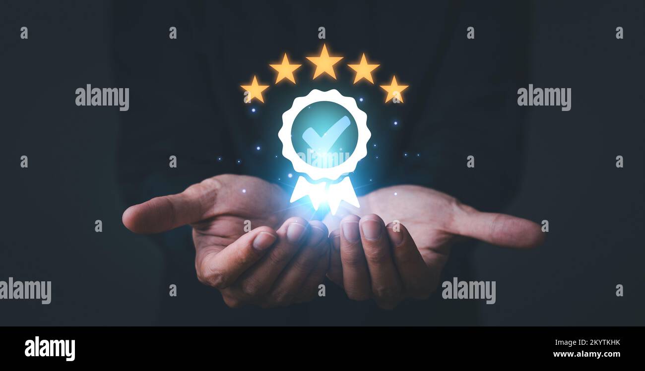 Service Quality assurance. Hand shows the sign of the top service Quality assurance 5 star, Guarantee, Standards, ISO certification and standardizatio Stock Photo