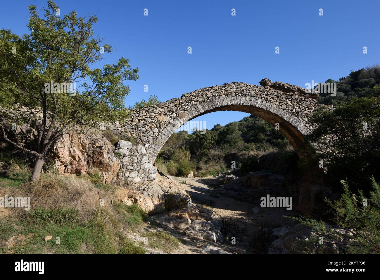 Old Stone Bridge or Humpback Bridge, Pont des Fées, over the River La Garde, Grimaud Var Provence France Stock Photo