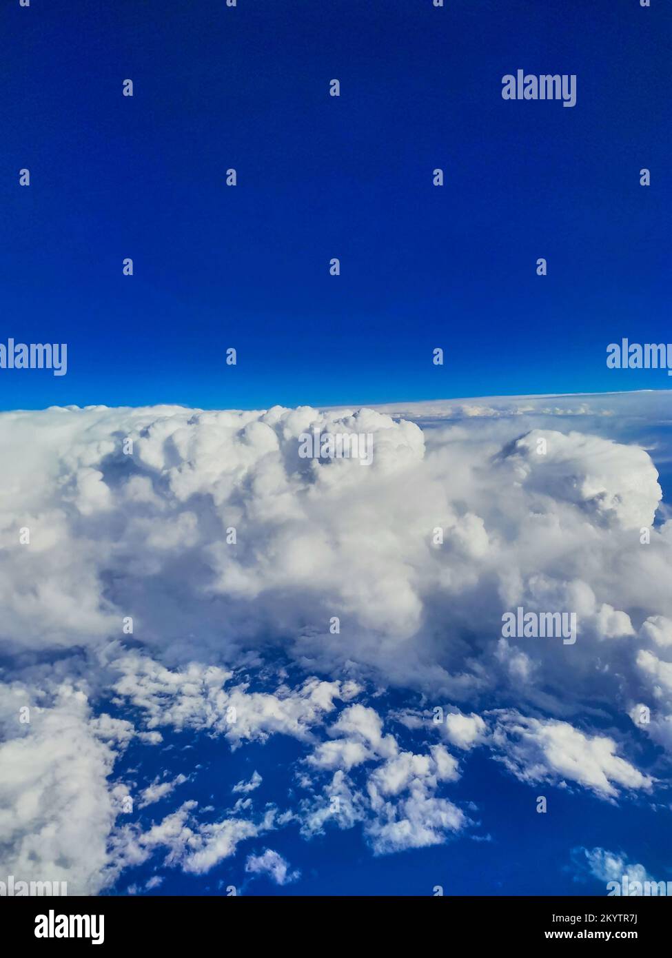 Aerial photo above the clouds with blue sky Stock Photo - Alamy