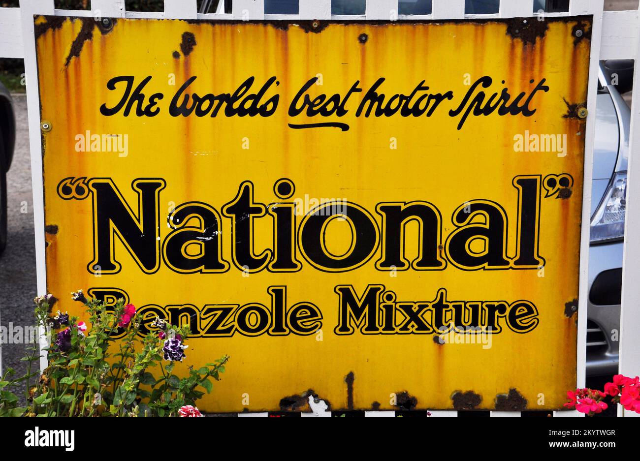 Enamelled metal sign, advertising 'National' Benzole Mixture photographed at Bishops Lydeard station on the West Somerset railway in Somerset,England, Stock Photo