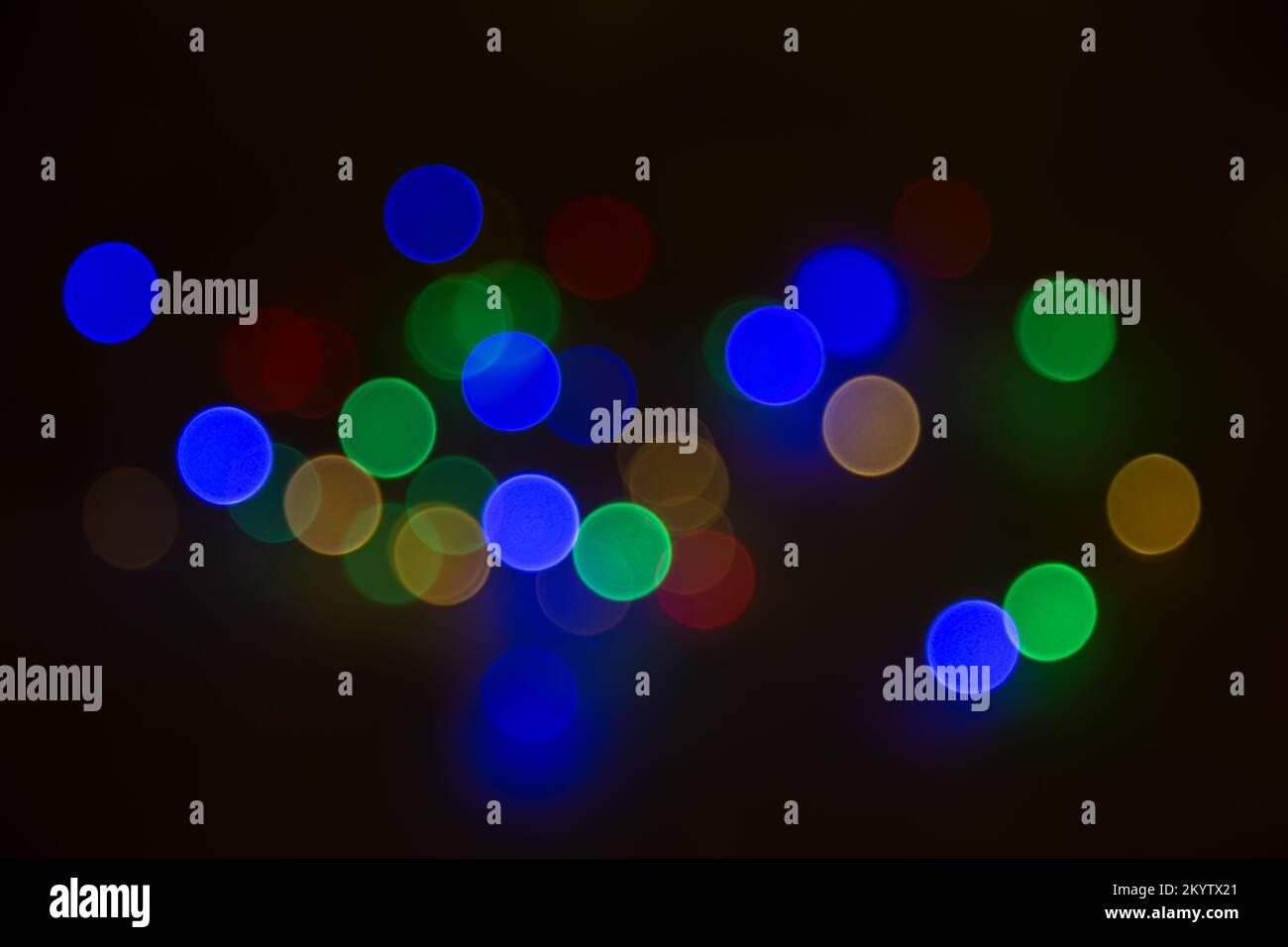 Abstract background, multicolored bokeh on a black background. Stock Photo