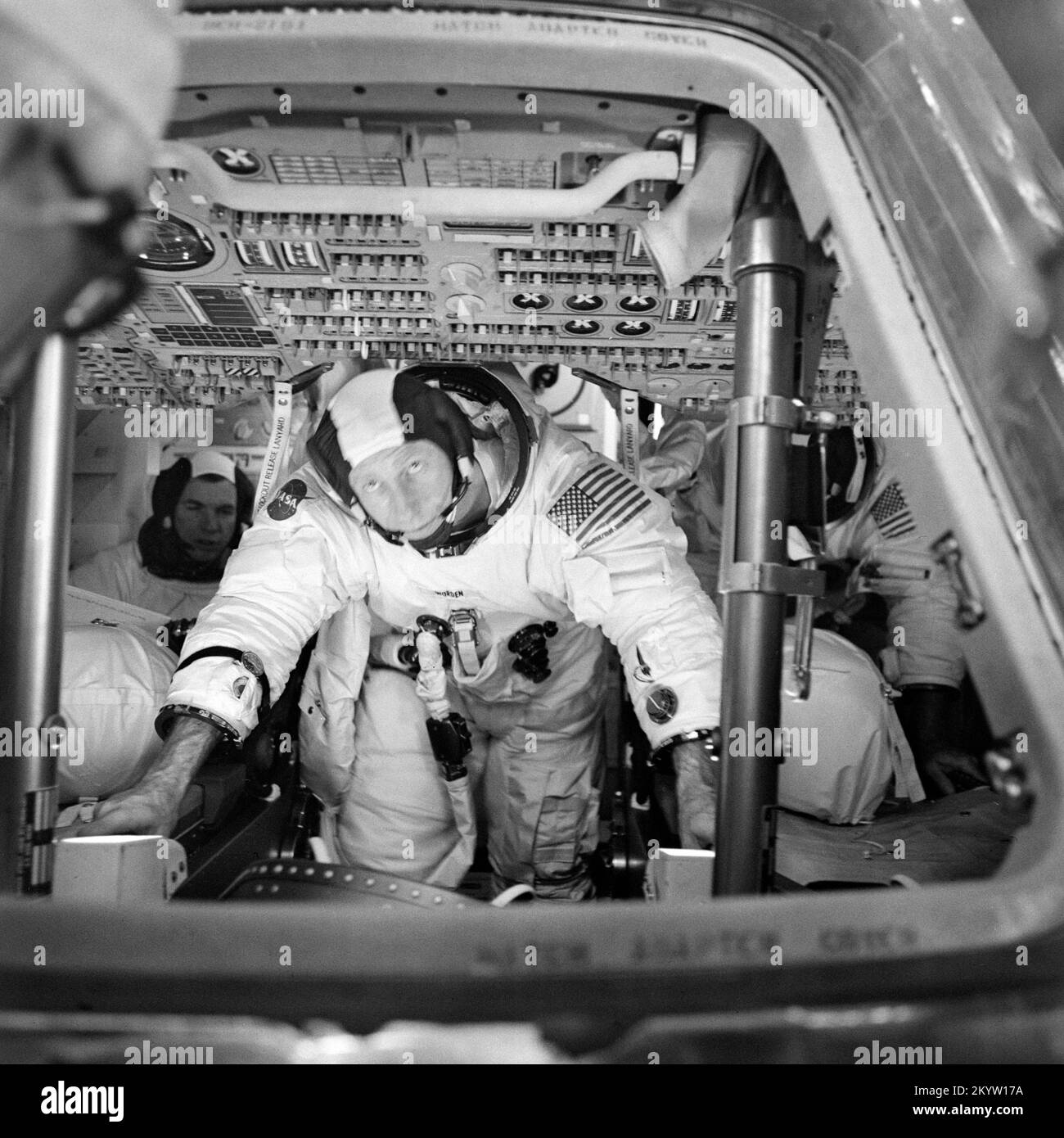 Astronaut Al Worden - in training The three Apollo 15 prime crew members can be seen inside the Apollo 15 Command Module (CM) during simulation training at the Kennedy Space Center (KSC). Astronaut David R. Scott, commander, is in the background to the left. Astronaut Alfred M. Worden, center foreground, is the command module pilot. Out of view, to the right background, is astronaut James B. Irwin, lunar module pilot.     Image Number: S71-29952  Date: March 26, 1971 Stock Photo