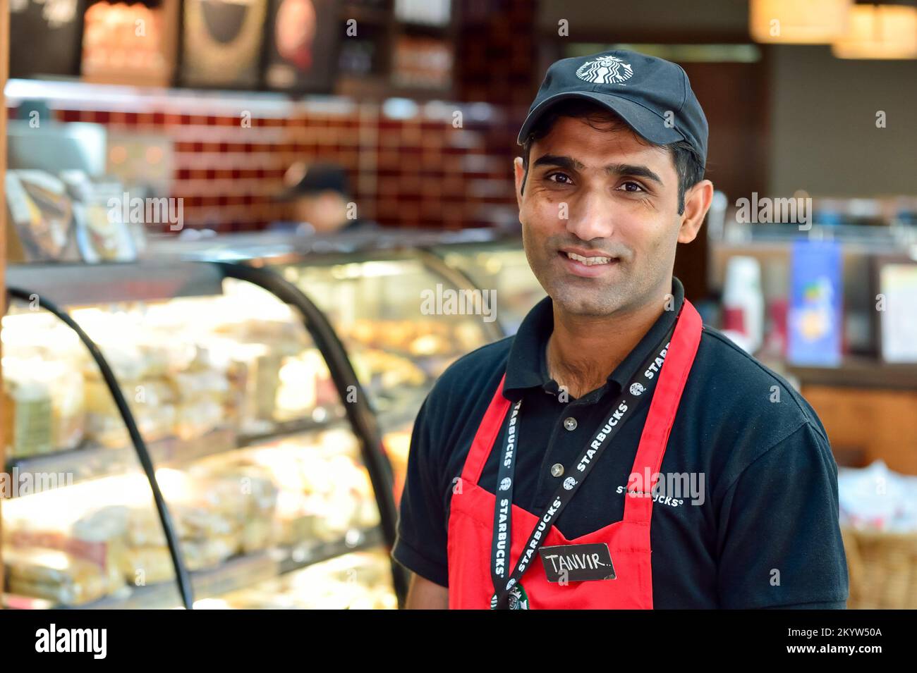 DUBAI, UAE NOVEMBER 16, 2015 barista in Starbucks cafe in Dubai