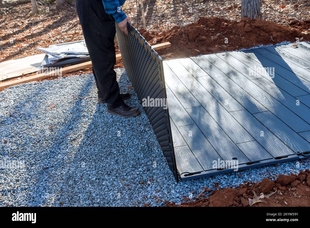 Putting together plastic shed for in back yard Stock Photo Alamy