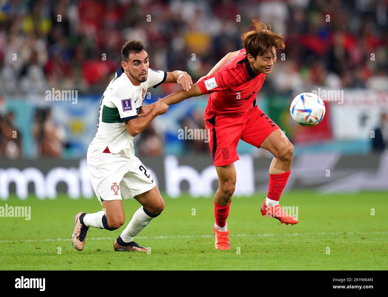 Portugal's Ricardo Horta (left) and South Korea's Kim Jin-su battle for the ball during the FIFA World Cup Group H match at the Education City Stadium in Al-Rayyan, Qatar. Picture date: Friday December 2, 2022. Stock Photo