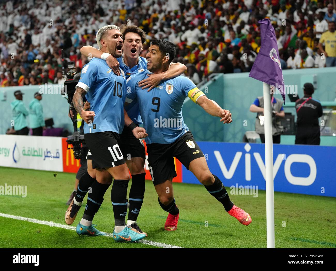 Uruguay's Giorgian de Arrascaeta celebrates scoring their side's first goal of the game with teammate Luis Suarez during the FIFA World Cup Group H match at the Al Janoub Stadium in Al-Wakrah, Qatar. Picture date: Friday December 2, 2022. Stock Photo