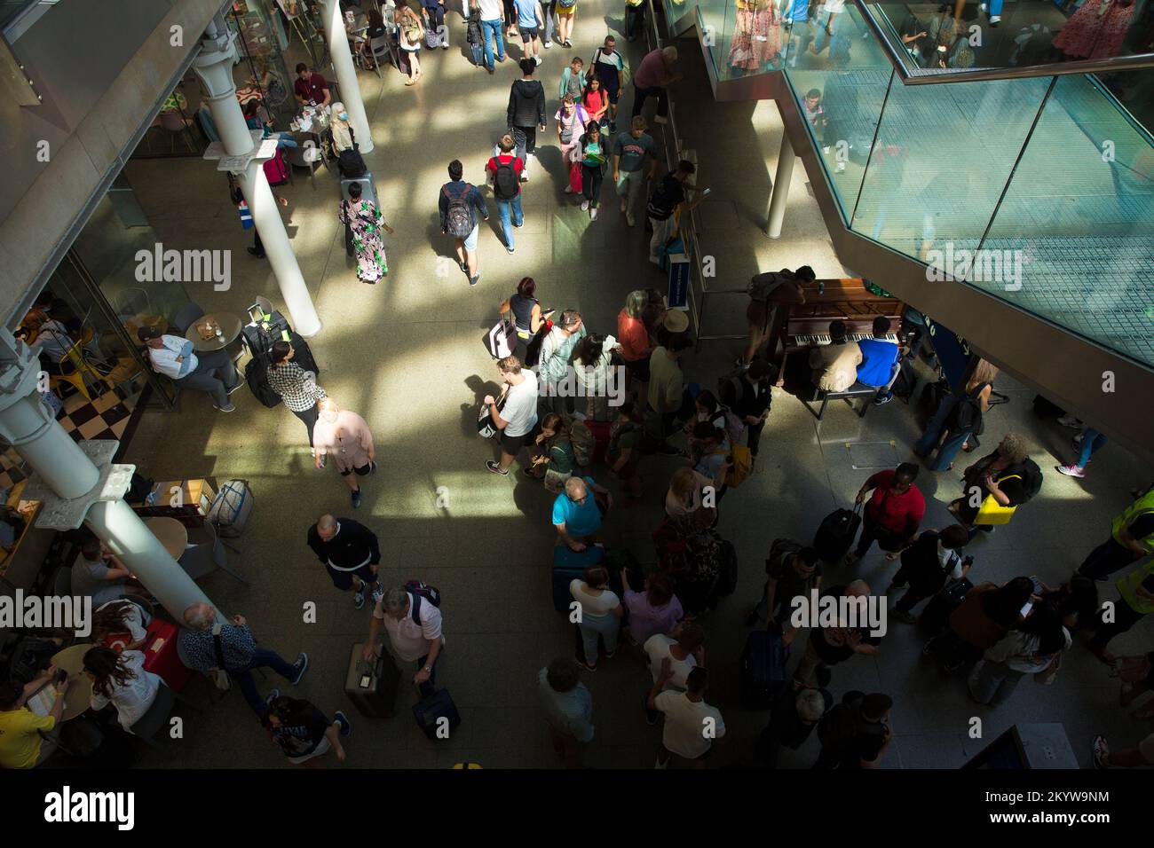 Passengers gather at St Pancras Station in central London, as many people are expected to go on holidays this weekend. Stock Photo