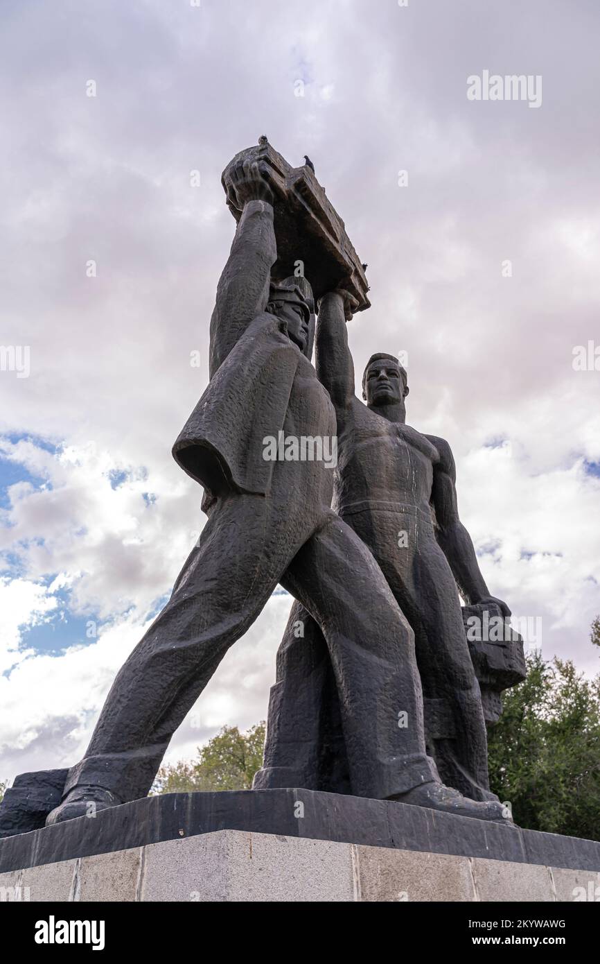 'Miners' Glory' Monument, sculpture depicting workers. Soviet monuments in Karagandy, Kazakhstan Stock Photo