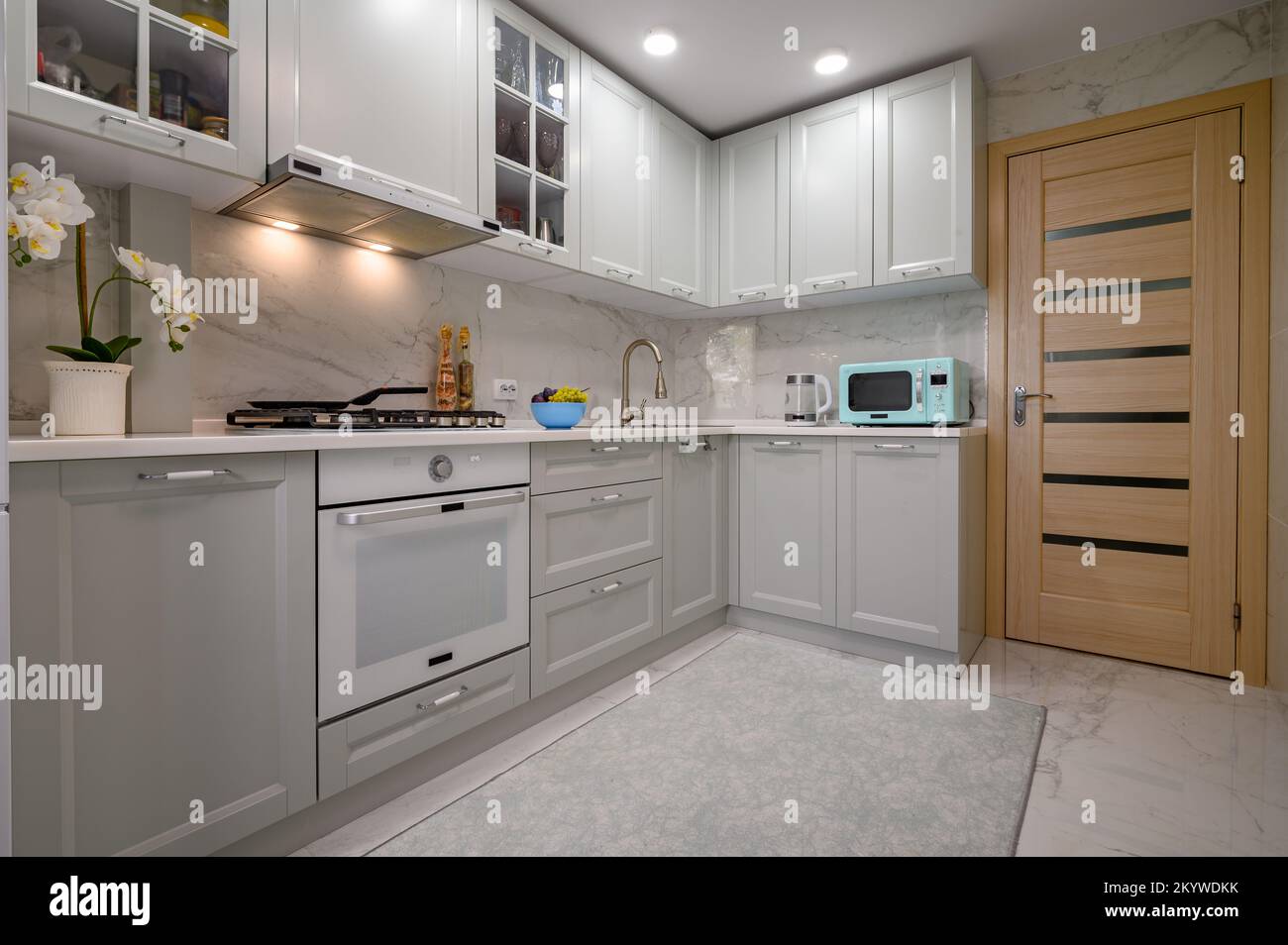 Light grey new modern well designed kitchen interior Stock Photo - Alamy