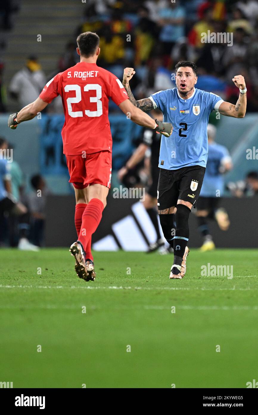 Al Wakrah, Qatar. 2nd Dec, 2022. Uruguay's goalkeeper Sergio Rochet (L) and player Jose Maria Gimenez celebrate team's second goal during the Group H match between Ghana and Uruguay at the 2022 FIFA World Cup at Al Janoub Stadium in Al Wakrah, Qatar, Dec. 2, 2022. Credit: Xin Yuewei/Xinhua/Alamy Live News Stock Photo