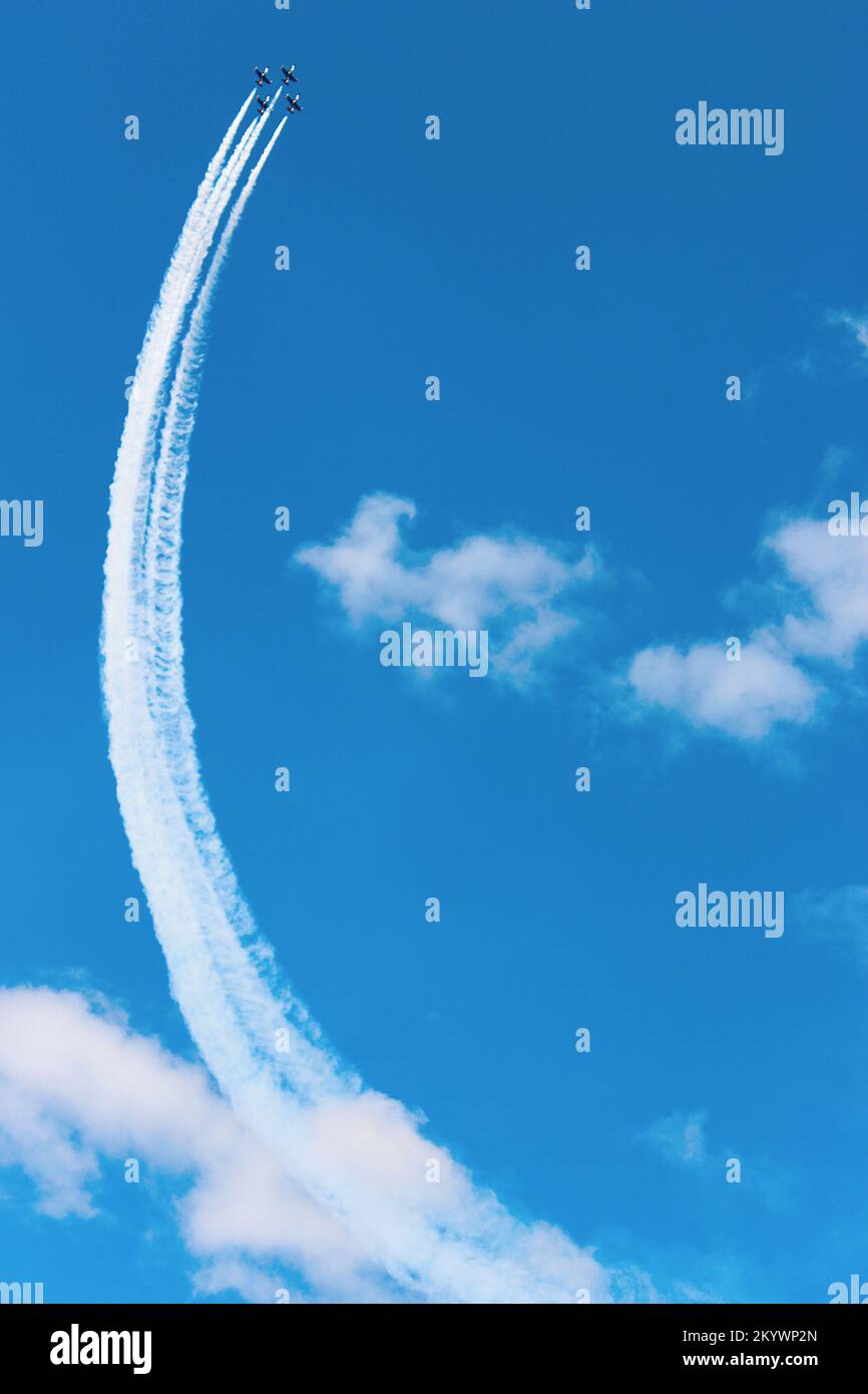 Aerobatics of four flying planes Stock Photo Alamy
