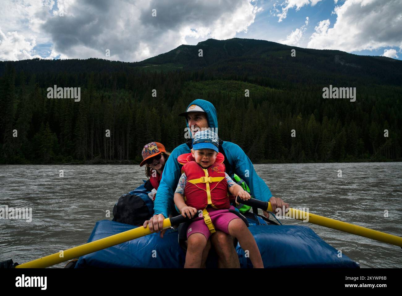Wide Raft A father and his son and daughter in a raft on a wide river Stock Photo ...