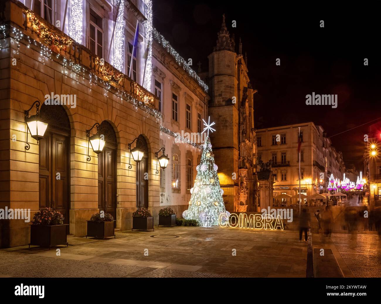 Coimbra, Portugal - December 1, 2022: Christmas lights in Coimbra, Portugal, with a Christmas tree in front of the City Hall and Santa Cruz church in Stock Photo