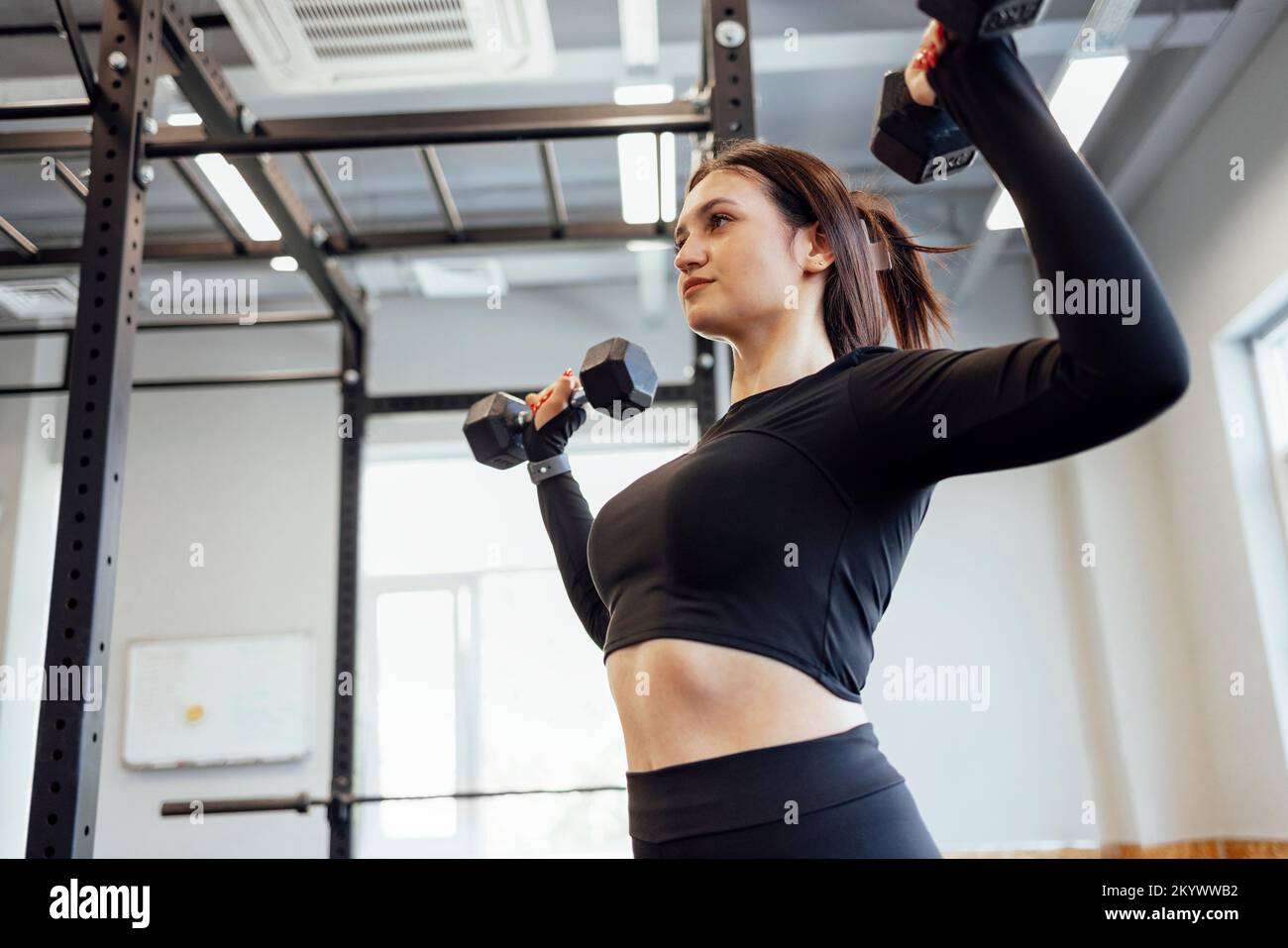 Gym Woman Doing Push Up Exercises With Dumbbells Strong Brunette