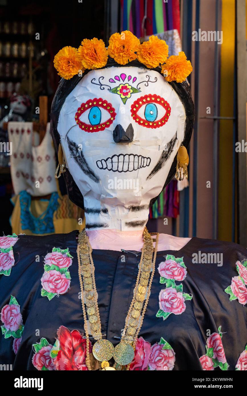 A papier mache mannequin dressed as a woman with marigolds on the street for Day of the Dead in Oaxaca, Mexico. Stock Photo
