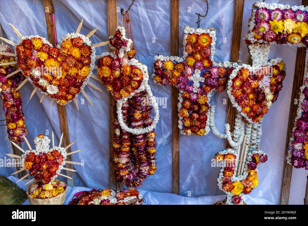 Floral crosses and hearts for sale for ofrendas for Day of the Dead or