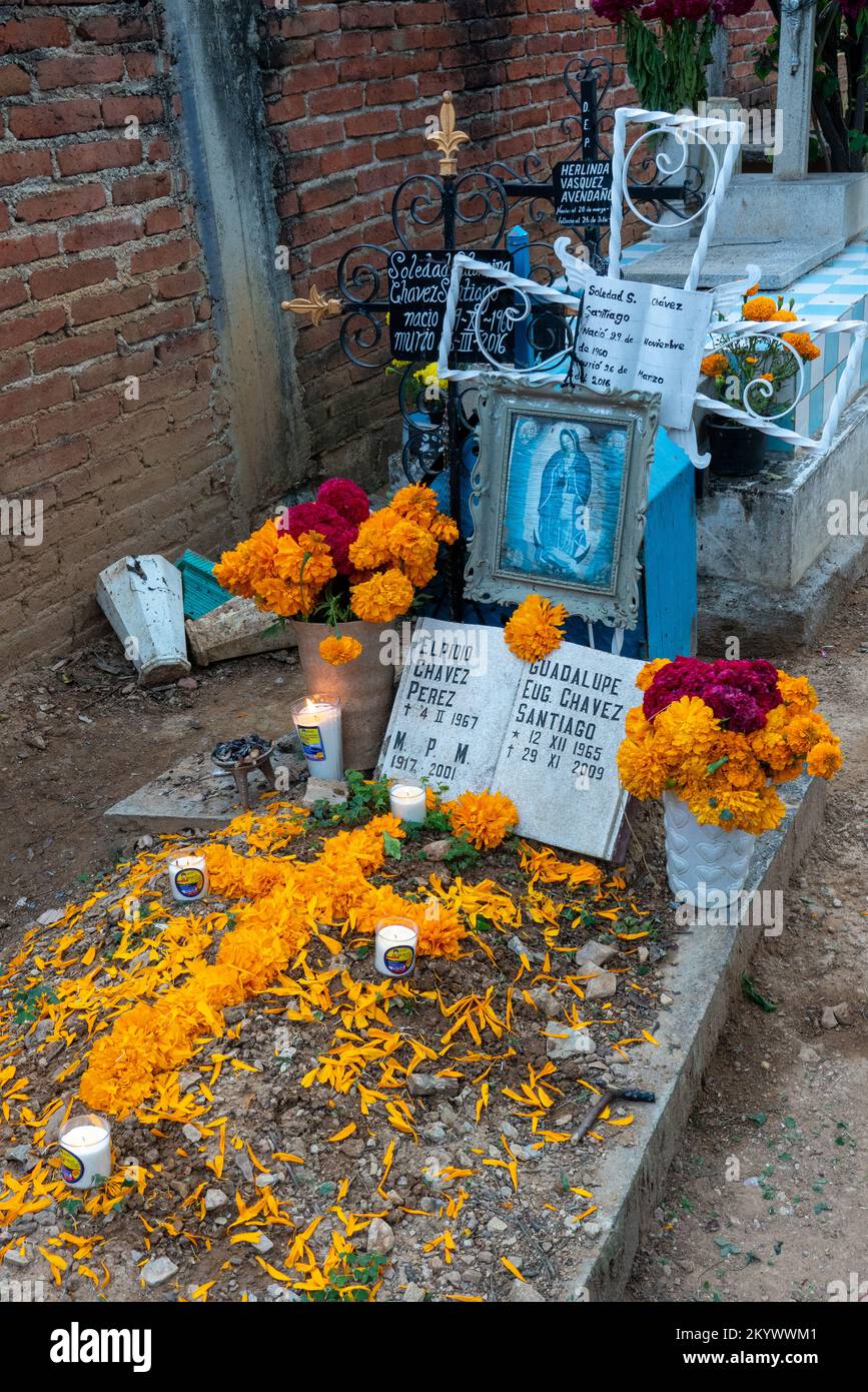 A grave in the Xochimilco Cemetery decorated for the Day of the Dead or Dia de los Muertos in Oaxaca, Mexico. Stock Photo