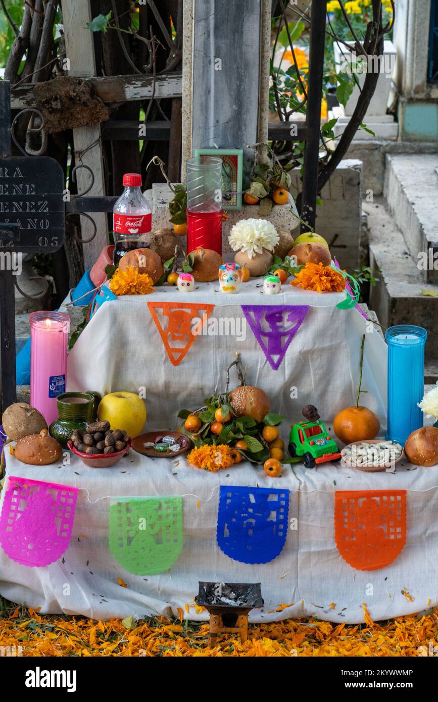 An ofrenda by a grave in the Xochimilco Cemetery decorated for the Day of the Dead or Dia de los Muertos in Oaxaca, Mexico. Stock Photo