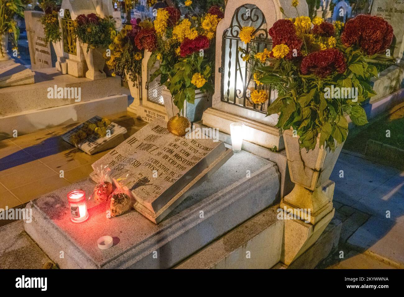 A grave in the Xochimilco Cemetery decorated for the Day of the Dead or Dia de los Muertos in Oaxaca, Mexico. Stock Photo