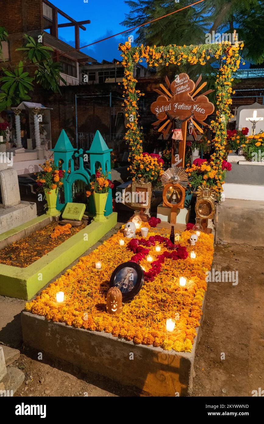 A grave in the Xochimilco Cemetery decorated for the Day of the Dead or Dia de los Muertos in Oaxaca, Mexico. Stock Photo