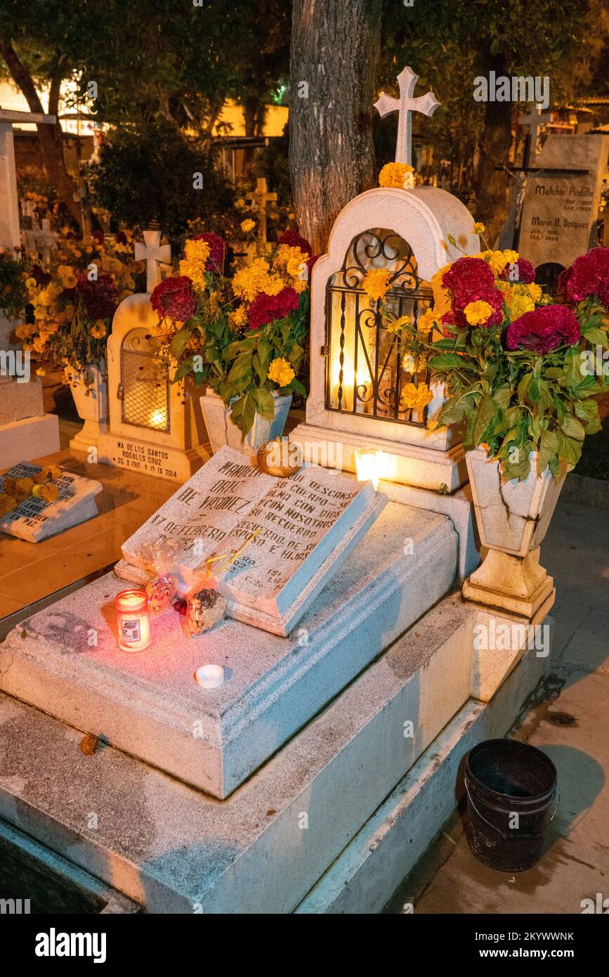 A grave in the Xochimilco Cemetery decorated for the Day of the Dead or Dia de los Muertos in Oaxaca, Mexico. Stock Photo