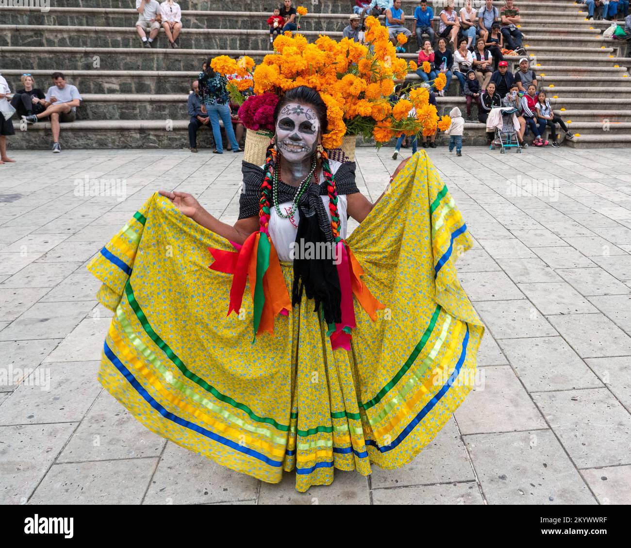 A woman with face painted and dressed for a costume competition for the Day of the Dead celebration in Oaxaca, Mexico. Stock Photo