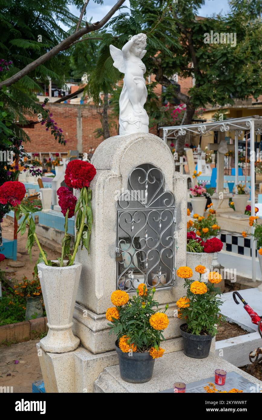 A grave in the Xochimilco Cemetery decorated for the Day of the Dead or Dia de los Muertos in Oaxaca, Mexico. Stock Photo