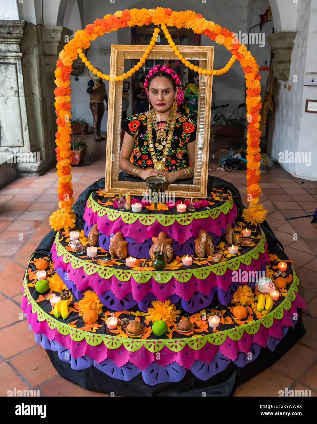 A woman dressed as an ofrenda for a costume competition for the Day of the Dead celebration in Oaxaca, Mexico. Stock Photo