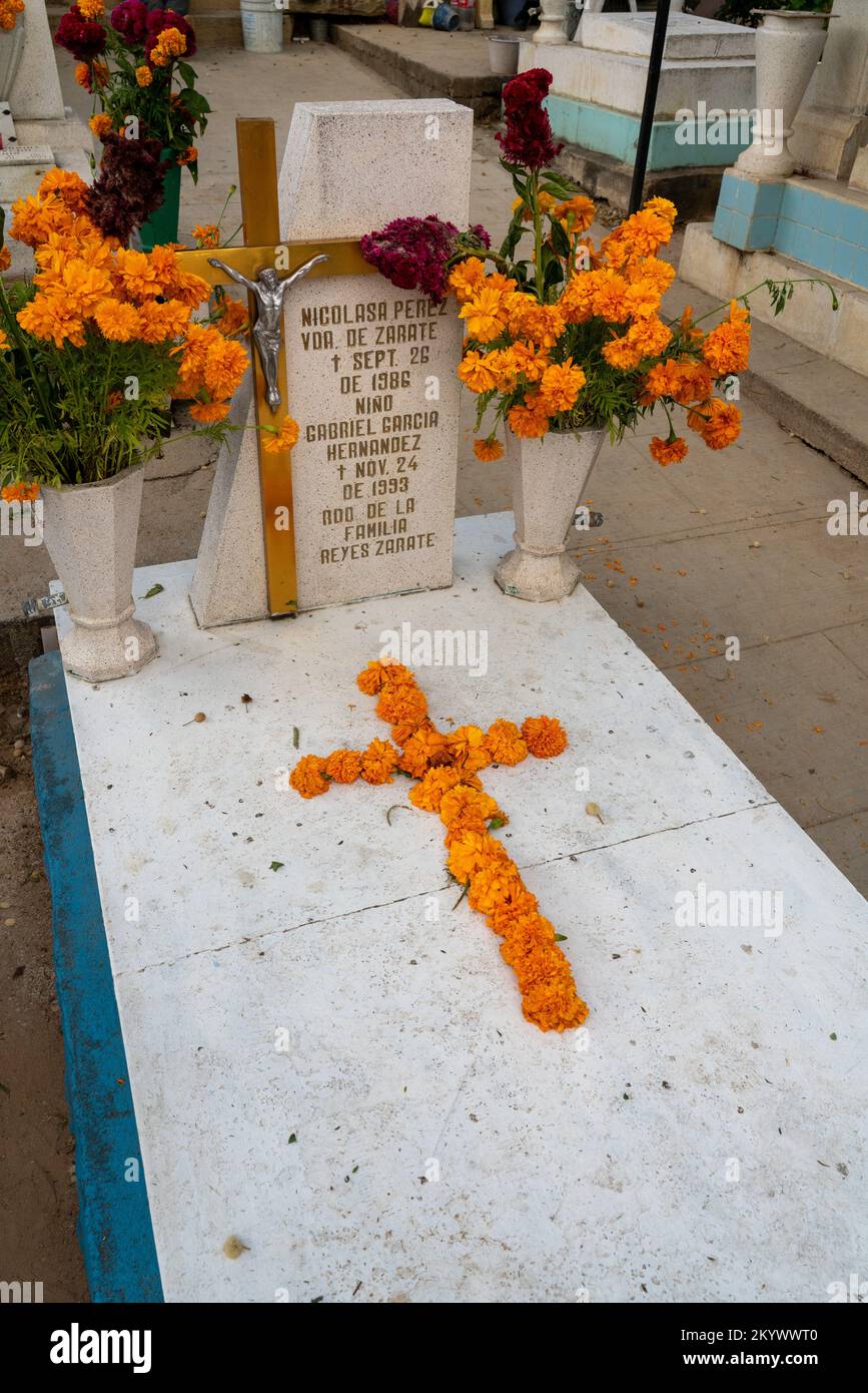 A grave in the Xochimilco Cemetery decorated for the Day of the Dead or Dia de los Muertos in Oaxaca, Mexico. Stock Photo