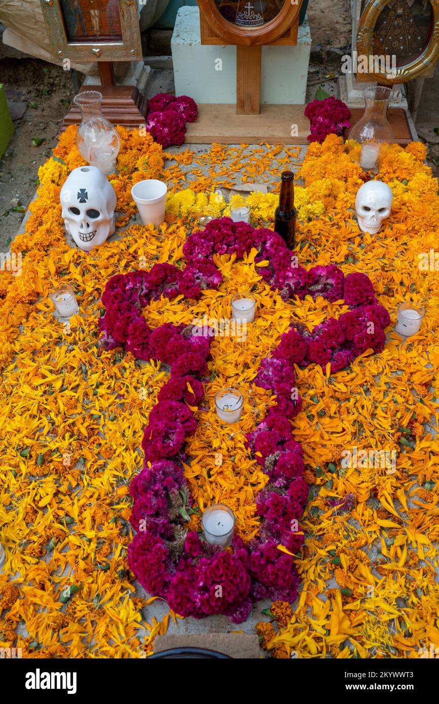 A grave in the Xochimilco Cemetery decorated for the Day of the Dead or Dia de los Muertos in Oaxaca, Mexico. Stock Photo