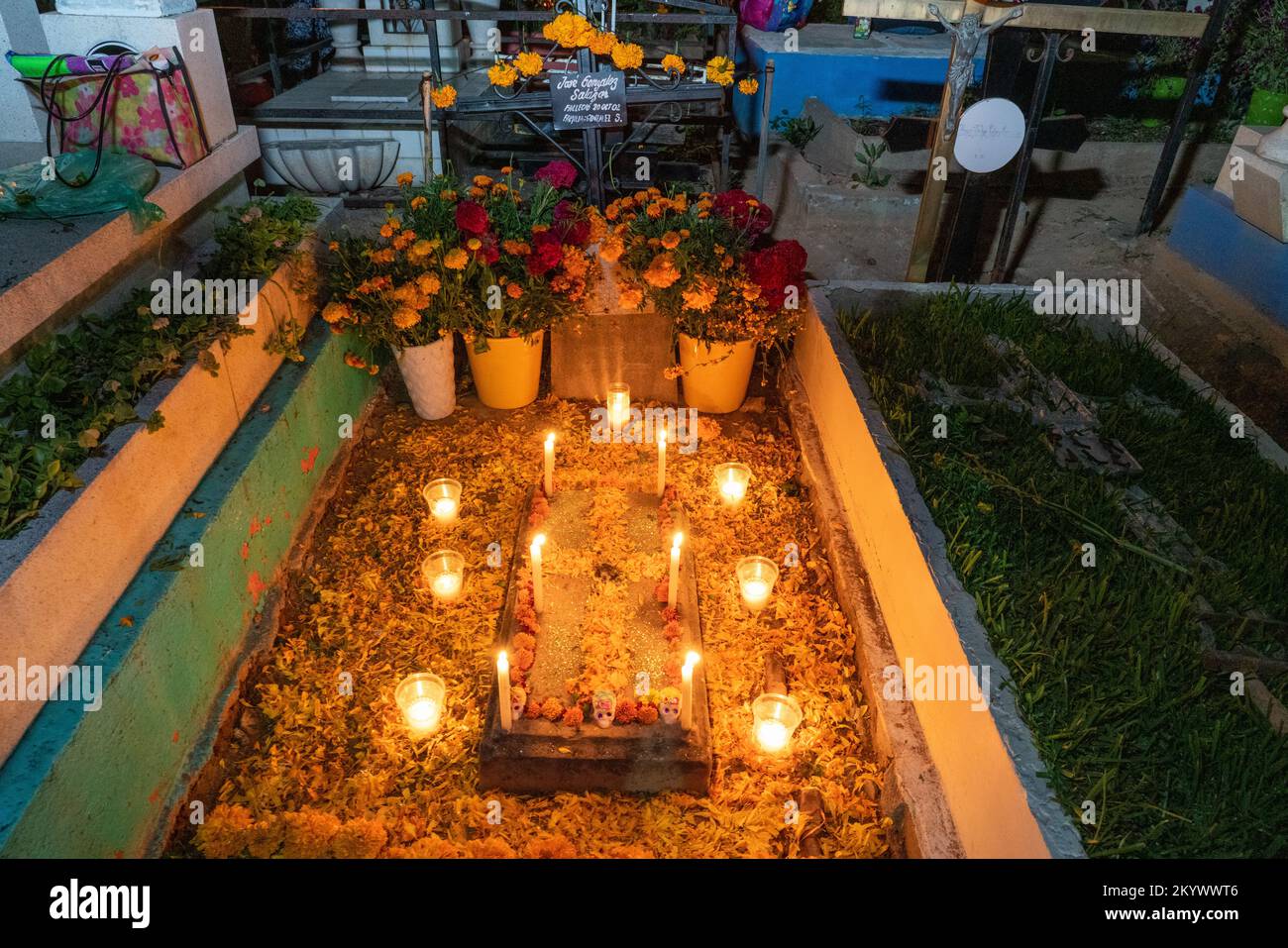 A grave in the Xochimilco Cemetery decorated for the Day of the Dead or Dia de los Muertos in Oaxaca, Mexico. Stock Photo