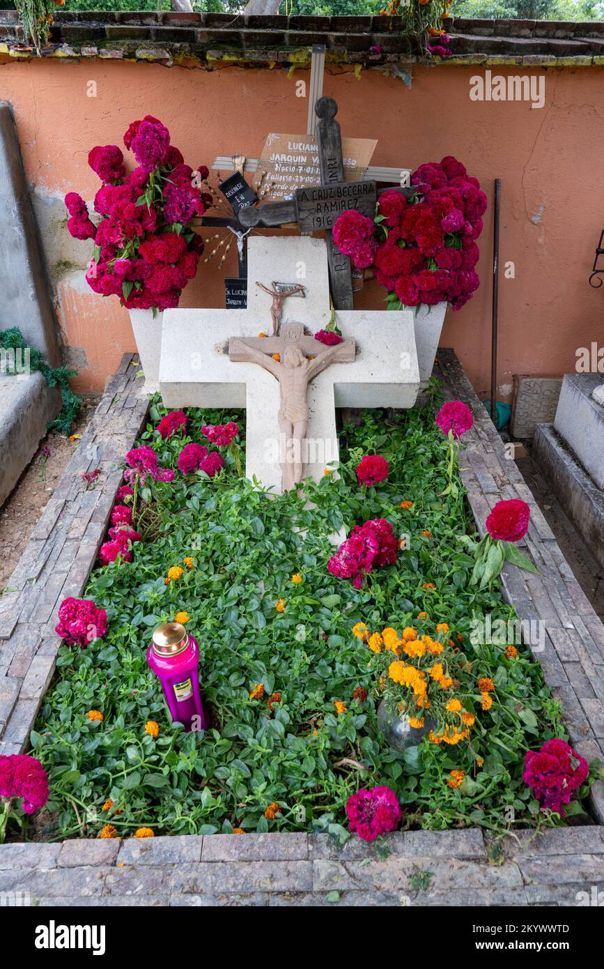 A grave in the Xochimilco Cemetery decorated for the Day of the Dead or Dia de los Muertos in Oaxaca, Mexico. Stock Photo