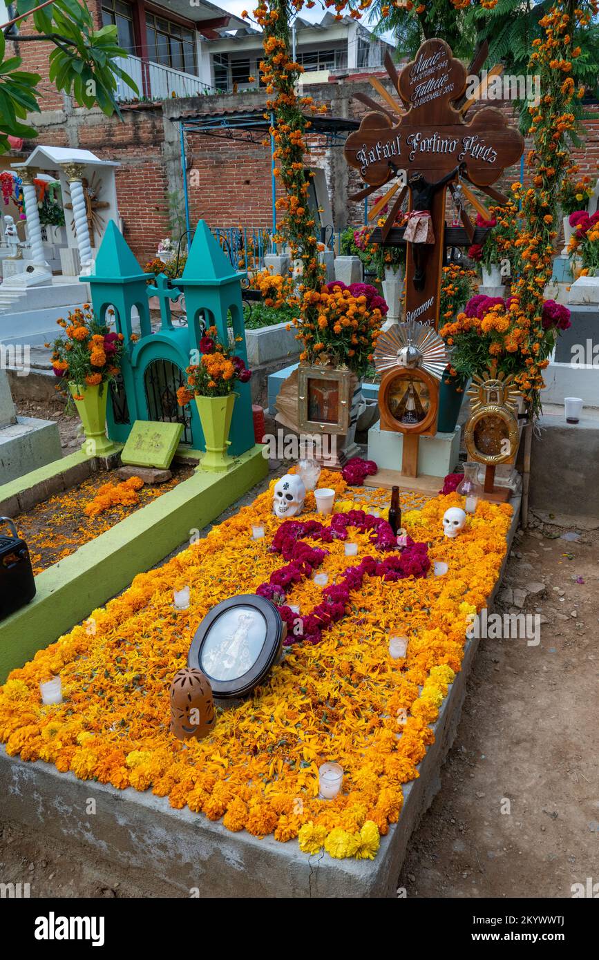 A grave in the Xochimilco Cemetery decorated for the Day of the Dead or Dia de los Muertos in Oaxaca, Mexico. Stock Photo