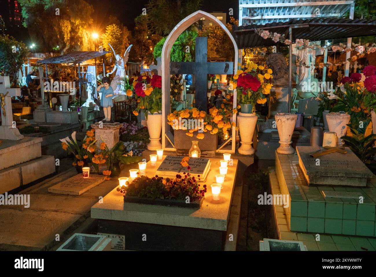 A grave in the Xochimilco Cemetery decorated for the Day of the Dead or Dia de los Muertos in Oaxaca, Mexico. Stock Photo