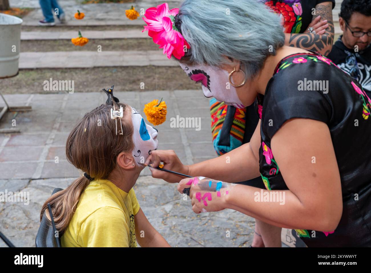 a-young-girl-getting-her-face-painted-for-the-day-of-the-dead