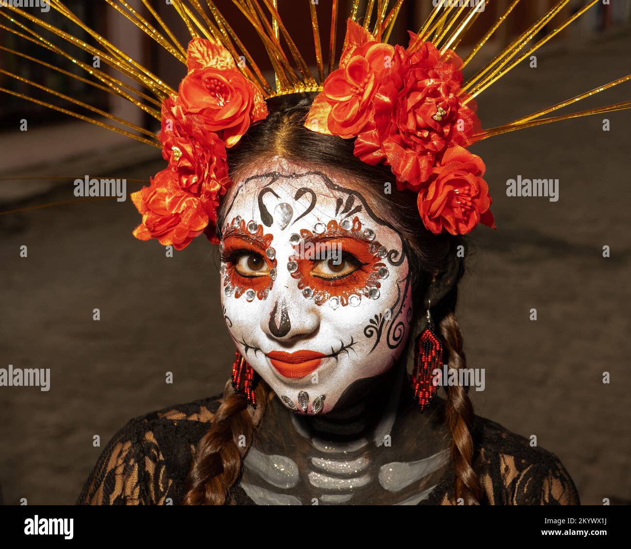 a-young-woman-with-her-face-painted-for-the-day-of-the-dead-celebration