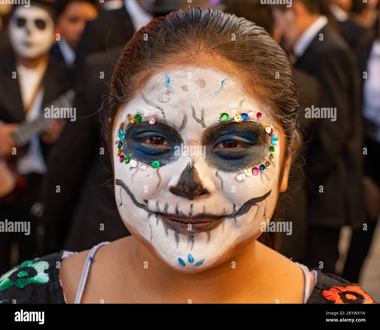 a-young-woman-with-her-face-painted-for-the-day-of-the-dead-celebration