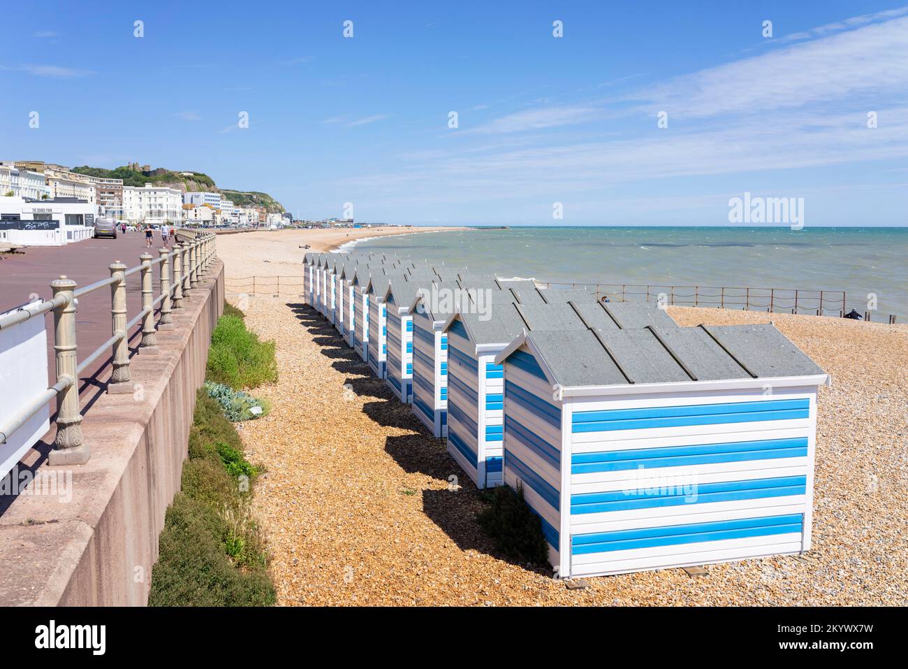 Hastings beach with blue and white striped painted beach huts Hastings
