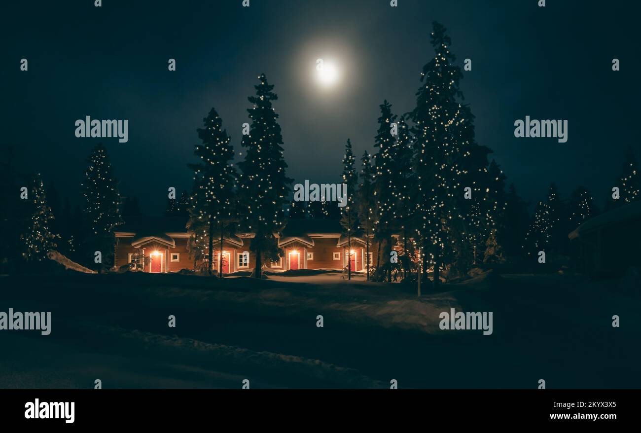 Christmas night landscape with snowy forest at full moon. Stock Photo