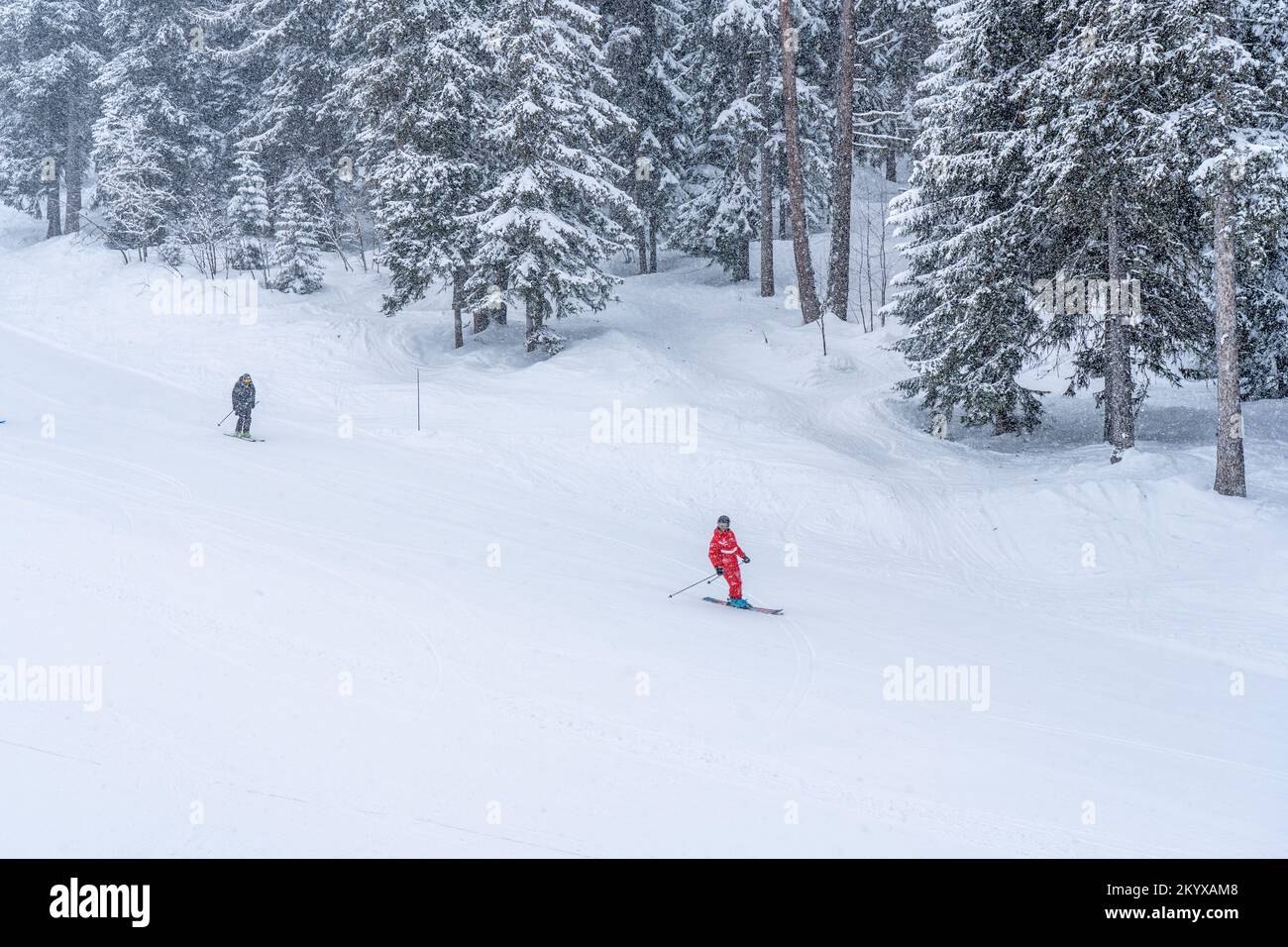 Ski instructor and skier in the french ski resort on mountain, skiing in heavy snow. Hight quality photoi Stock Photo