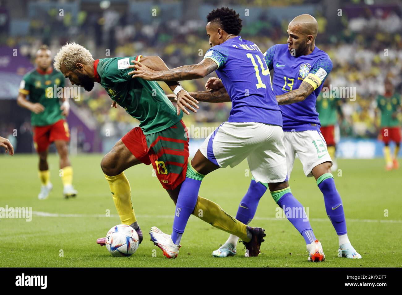 Qatar. 02nd Dec, 2022. LUSAIL CITY - (l-r) Eric Maxim Choupo-Moting of Cameroon, Eder Militao of Brazil, Dani Alves of Brazil during the FIFA World Cup Qatar 2022 group G match between Cameroon and Brazil at Lusail Stadium on December 2, 2022 in Lusail City, Qatar . AP | Dutch Height | MAURICE OF STONE Credit: ANP/Alamy Live News Stock Photo