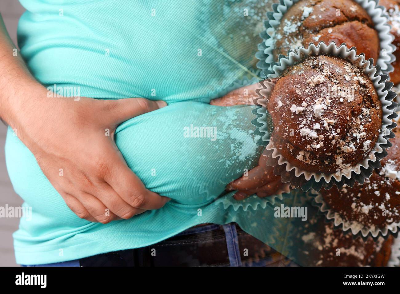 Obesity and junk food. Man clutching his belly fat and chocolate cupcakes. Stock Photo
