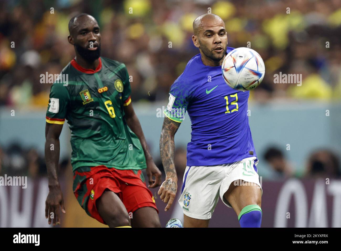 Qatar. 02nd Dec, 2022. LUSAIL CITY - (l-r) Nicolas Ngamaleu of Cameroon, Dani Alves of Brazil during the FIFA World Cup Qatar 2022 group G match between Cameroon and Brazil at Lusail Stadium on December 2, 2022 in Lusail City, Qatar. AP | Dutch Height | MAURICE OF STONE Credit: ANP/Alamy Live News Stock Photo