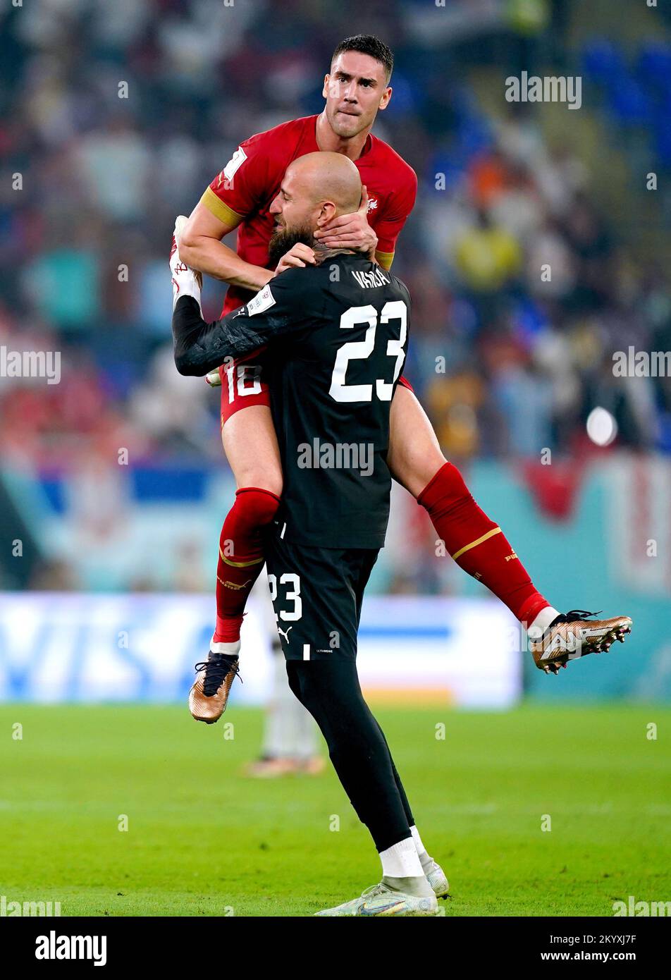 Serbia's Dusan Vlahovic (top) celebrates with goalkeeper Vanja Milinkovic-Savic after scoring their side's second goal of the game during the FIFA World Cup Group G match at Stadium 974 in Doha, Qatar. Picture date: Friday December 2, 2022. Stock Photo