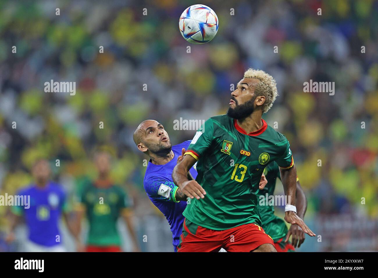 Lusail Iconic Stadium, Lusail, Qatar. 2nd Dec, 2022. FIFA World Cup Football, Cameroon versus Brazil; Eric Maxim Choupo-Moting of Cameroon wins the header from Daniel Alves do Brasil Credit: Action Plus Sports/Alamy Live News Stock Photo