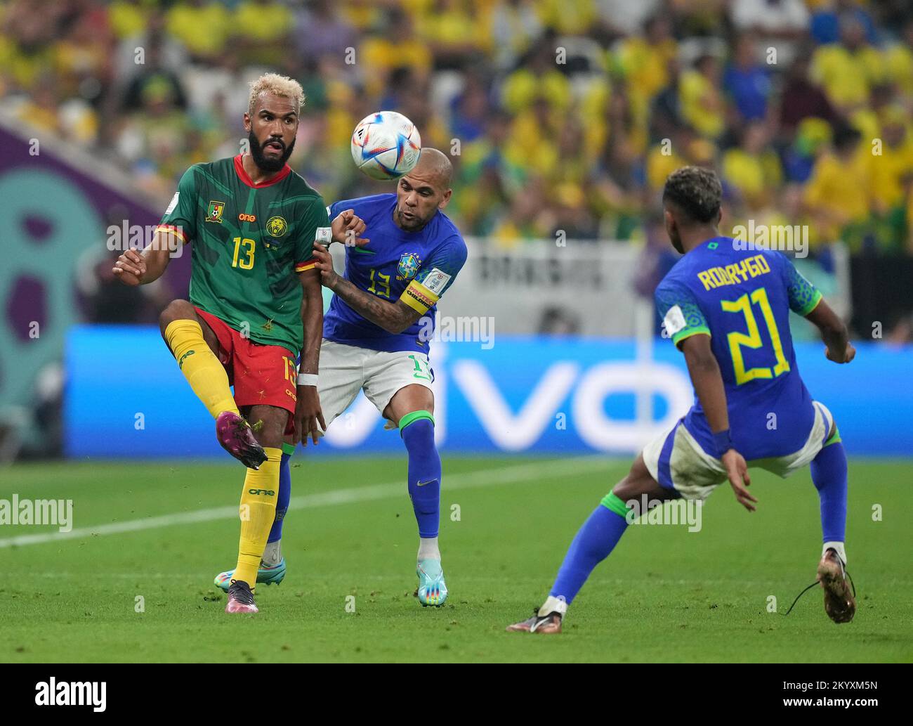 Cameroon's Eric Maxim Choupo-Moting (left) and Brazil's Dani Alves battle for the ball during the FIFA World Cup Group G match at the Lusail Stadium in Lusail, Qatar. Picture date: Friday December 2, 2022. Stock Photo